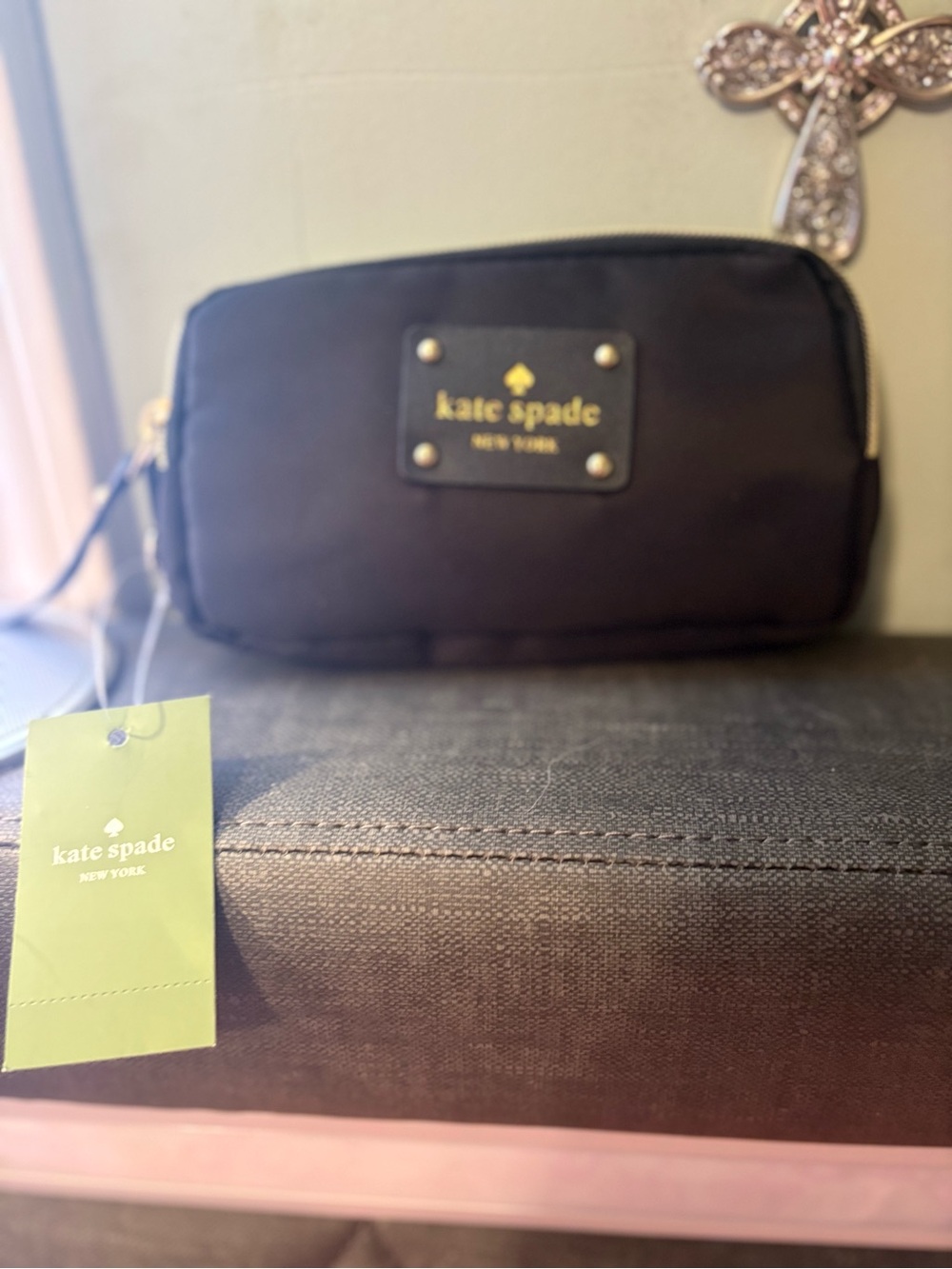 kate spade black clutch wristlet with gold logo